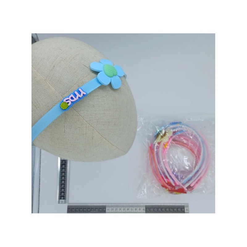 diadema de plástico infantil con adorno variedad de colores C/12 G16-4A-11